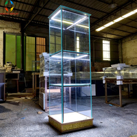 Vitrine en verre trempé avec éclairage LED personnalisé et base illuminée pour boutique de bijoux et centre commercial