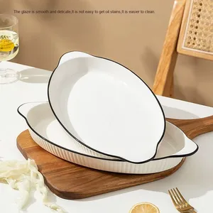 Plat de cuisson moderne <span class=keywords><strong>en</strong></span> céramique blanche avec doubles poignées et bord noir, plat ovale <span class=keywords><strong>en</strong></span> <span class=keywords><strong>porcelaine</strong></span> pour poisson, pâtes, salade, hôtel, restaurant - Product Image 1