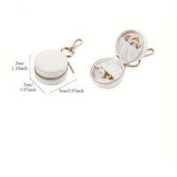 Boîte de rangement pour bijoux en cuir PU mini, très vendue, avec porte-clés, breloques pour sac, organiseur de bijoux de voyage, étui à bijoux rond