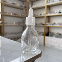 Vente en gros de flacons compte-gouttes transparents en verre épais de 50 ml en stock, emballage cosmétique en verre.