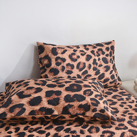 Ensemble de linge de lit 100% polyester à motif léopard, 4 pièces : housse de couette, drap plat et taies d'oreiller pour chambre à coucher