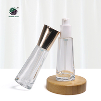 Nouveau design de bouteilles cosmétiques en verre transparent vides de 30ml avec distributeur de pompe à lotion à bec en plastique de 20mm pour la crème