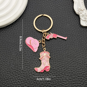 Ciondolo portachiavi stile coppia, con cappello da <span class=keywords><strong>cowboy</strong></span> western marrone retrò americano, stivali, pistola e borsa a tracolla dolce e cool. - Product Image 6