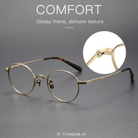 Lunettes de vue de qualité supérieure en gros, style européen Gafas Negras, monture optique en titane, style Vogue rétro
