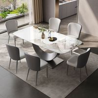 Ensemble de table à manger de cuisine moderne avec plateau en pierre frittée blanche fixe et pieds en acier inoxydable brossé noir pour la maison et l'hôtel