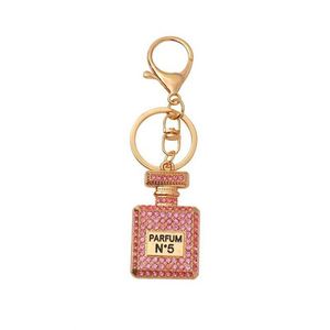 Llavero de metal creativo y de moda con colgante de coche de diamantes de imitación, botella de perfume con esmalte impreso y diamantes, colgante para bolso de mujer - Product Image 6