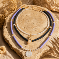 Collier ras du cou multi-rangs 3 brins en perles d'argile noires et violettes, coquillages, étoiles de mer et perles, bijoux fantaisie pour femme, pendentif tendance