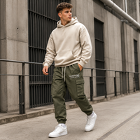 Pantalon de jogging homme en sergé tissé à cordon de serrage, poches cargo, impression sérigraphiée, revers élastiques, style streetwear, marque privée