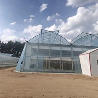 Serre agricole de grande taille ZhuoTai personnalisable en acier galvanisé à structure tubulaire ronde en treillis pour films solaires