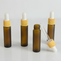 Flacon compte-gouttes en verre vide personnalisable par le fabricant avec bouchon imprimé effet bois pour l'emballage d'huile à barbe pour hommes