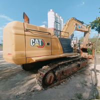 Excavatrice CAT 374 d'occasion, 74T, moteur haute puissance 359 kW, grande benne pour travaux de construction lourde