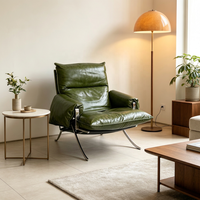 Fauteuil lounge italien contemporain à dossier haut en cuir, avec structure en acier inoxydable poli miroir, courbée en X et en forme de barre plate
