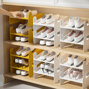 Étagère à chaussures pliable Xinzao à 2 niveaux, organisateur de rangement gain de place pour placard et chambre, blanc et jaune - Product Image 1