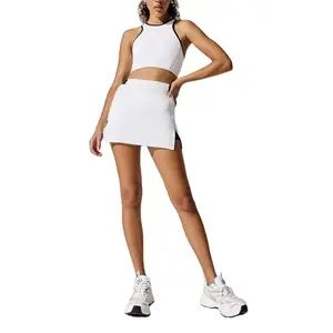 महिलाओं के लिए फैशन एथलेटिक स्पोर्ट्सवियर सेट योगा शॉकप्रूफ ब्रा जिम ट्रेनिंग प्लीटेड टेनिस स्कर्ट 2 पीस टेनिस स्कर्ट सेट