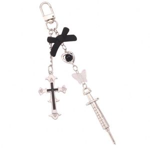 New Sweet Cool Style Cross Needle Pendant Metal <b>Keychain</b> <b>Personalized</b> Creative Bow Tie Hanging Chain Earphone Set Decoration - Product Image 6