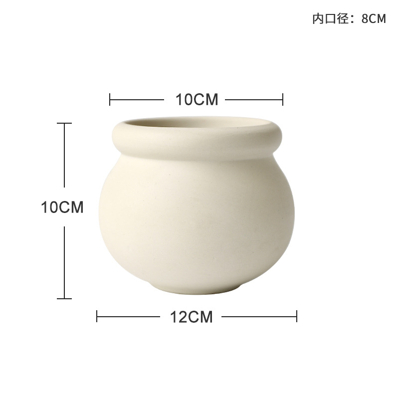Petit pot de fleur rond en poterie blanche avec trous