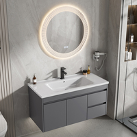 Meuble-lavabo mural moderne et concis en aluminium avec porte en PVC, vasque en céramique grise, miroir à capteur tactile et étagères