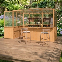Serre en polycarbonate incliné avec comptoir de bar intégré, pour jardin d'hiver extérieur, abri pour plantes, servant également de véranda ou de jardin d'hiver.