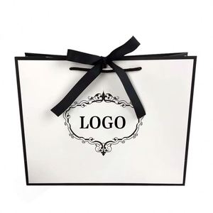 Empaque de Regalo de Papel Artístico Reciclable de Lujo, Ecológico y Hecho a Mano, con Asas de Cinta Troqueladas Personalizadas para Ropa, Venta al Por Mayor - Product Image 5