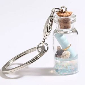พวงกุญแจอะคริลิคใสลายปลาดาวในขวดลอยน้ำ - Product Image 1