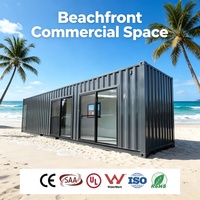 Café de plage en conteneur amovible résistant à l'air marin avec auvent et comptoir en verre coulissant pour les commerces alimentaires sur passerelle