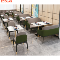 Ensemble table et chaises de restaurant moderne avec fauteuils rembourrés bicolores pour projets hôteliers