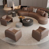 Ensemble canapé incurvé une place et table basse en PU pour salon de beauté, club, espace lounge, hall d'hôtel, bureau de vente, salle de réunion, coin réception