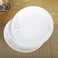 Assiette à manger exquise en céramique Assiette plate en céramique de restaurant Assiette blanche à motifs Ensemble de vaisselle en céramique