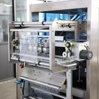 Machine verticale automatique de remplissage, d'emballage, d'étiquetage et de scellage pour poudres, granulés, sachets, pochettes, sacs de forme, bâtonnets, sauces et boissons