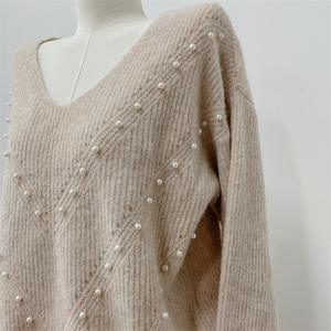 Suéter de Cachemira de nuevo diseño, jerséis informales acogedores de Color sólido, ropa elegante de manga larga con perlas para mujer - Product Image 5