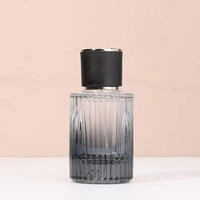 Flacon de parfum en verre à rayures verticales noir de luxe 50 ml avec bouchon rond et atomiseur, conteneur vide pour cosmétiques