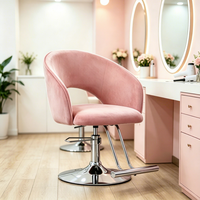 Chaise de barbier élégante et luxueuse, réglable en hauteur avec fonction hydraulique et accoudoirs en velours, pour salon de coiffure ou usage domestique.