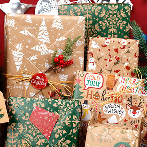 Venta al por mayor 80g Navidad oro estampado papel Kraft 43*300cm regalo lujo embalaje personalizado rollo de papel de regalo - Product Image 2