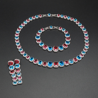 Ensemble de collier, bracelet et boucles d'oreilles en zircon rouge et bleu de luxe pour femmes, bijoux élégants en cristal pour mariage, soirée, robe de soirée