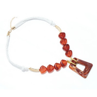 Collier pendentif corde tendance 2027, bijoux fantaisie dorés avec perles marron et rouges, style bohème, pour femme