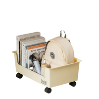 Organisateur de livres et de sacs à dos moderne sous table, solution de rangement mobile à roulettes pour dortoirs d'étudiants et salons