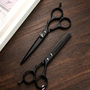 Ensemble de ciseaux de coiffure en acier inoxydable, comprenant des ciseaux à effiler et des ciseaux plats, spécialement conçus pour couper les franges. - Product Image 1
