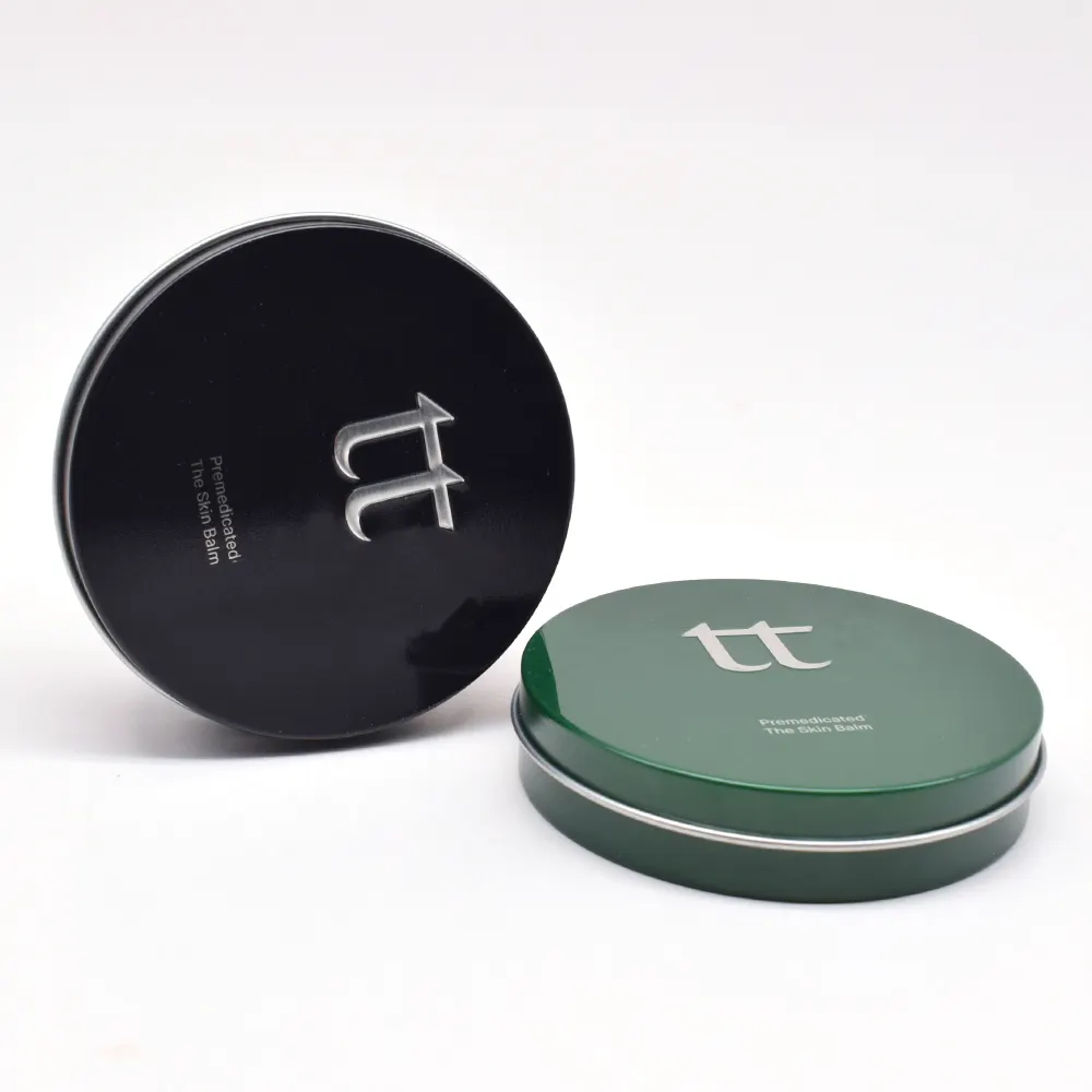 Logotipo en relieve personalizado Tamaño pequeño Bálsamo cosmético negro Pastilla de caramelo Caja de lata de regalo Caja de metal redonda de lata personalizada