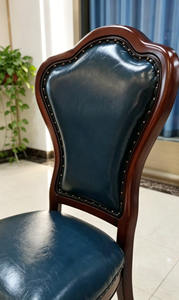 Chaise de salle à manger vintage en bois massif, forme tulipe, avec revêtement en cuir PU vert foncé et garniture à rivets, pieds tournés - Product Image 3