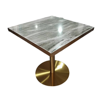 Table à manger de restaurant élégante de bonne qualité en pierre de terrazzo personnalisée en or galvanisé en acier inoxydable