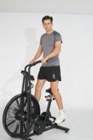 Vélo d'exercice en acier de qualité commerciale, résistance magnétique, écran LCD, transmission par chaîne, résistance réglable pour la maison/la salle de sport, fourni directement par l'usine