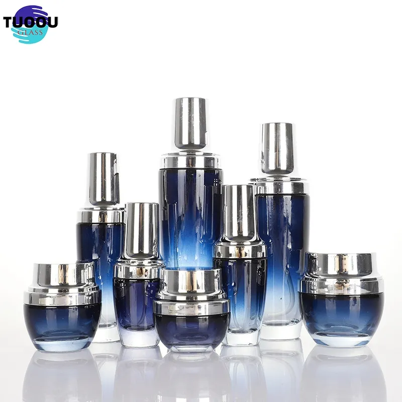 In Stock Luxury wholesale dark blue cosmetic glass lotion bottles with gold pump