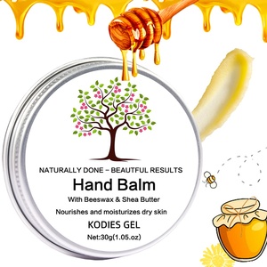 OEM/Baume de soin des cuticules avec logo personnalisé Crème pour les cuticules pour réparer les <span class=keywords><strong>ongles</strong></span> Baume pour les mains à la cire <span class=keywords><strong>d</strong></span>'abeille et au miel - Product Image 1