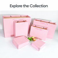 Sacs cadeaux en papier cartonné blanc personnalisés pour ensembles de mode, emballages d'achat personnalisés pour les boutiques de détail