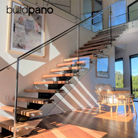 Escalier contemporain en acier à une seule poutre avec marches en noyer et balustrade en verre pour projets de duplex et de maisons jumelées