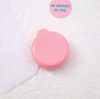 Miroir cosmétique rond pliable en plastique à double face éclairé avec couleur et logo personnalisés