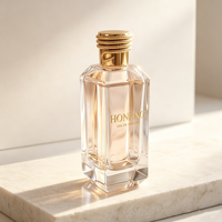 Flacon de parfum en verre transparent carré de 100 ml avec logo doré personnalisé, base épaisse, bouchon doré, emballage cosmétique