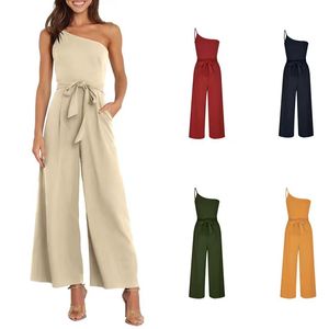 Mono de verano elegante para mujer, holgado, de color liso, con un hombro descubierto, lazo, cintura alta y bolsillos - Product Image 1