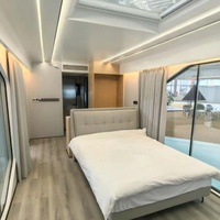 Maison capsule moderne de luxe en acier préfabriquée de 40 pieds, 1/2 chambre, mini-maison Apple, capsule spatiale solaire, salon, salle de bain pour usage hôtelier