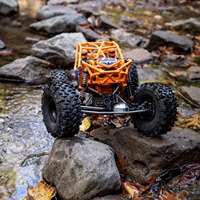 Axial RBX10 Ryft 1/10 4WD Brushless Rock Bouncer RTR 4S LiPo Buggy RC Tout-Terrain Haute Vitesse Orange AXI03005T2